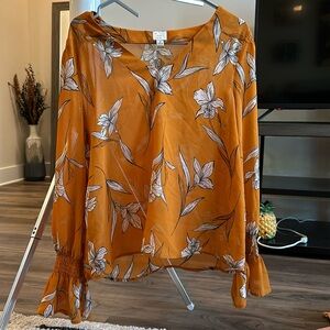 Medium yellow blouse with white flowers